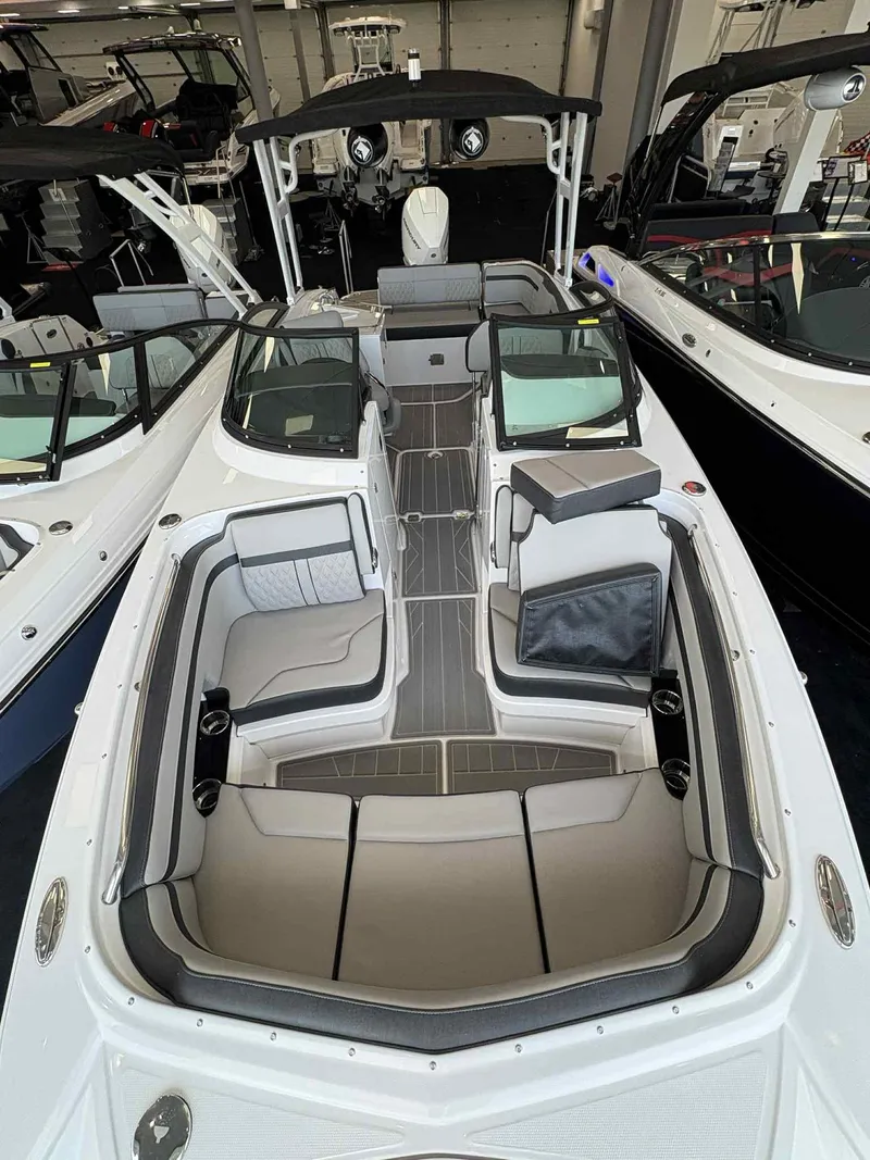 Slide: The Image of 2026 Monterey M65 boat interior with sleek seating and modern design in a showroom. - 3