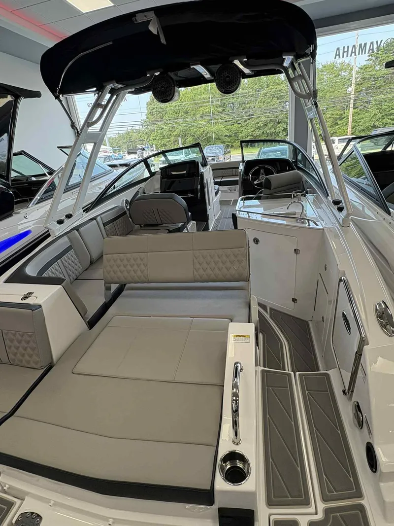 Slide: The Image of 2026 Monterey M65 boat interior with luxurious seating and modern design in showroom. - 4