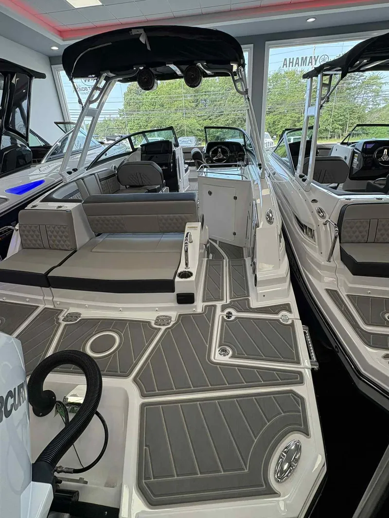 Slide: The Image of 2026 Monterey M65 boat interior with sleek seating and modern design in showroom. - 5