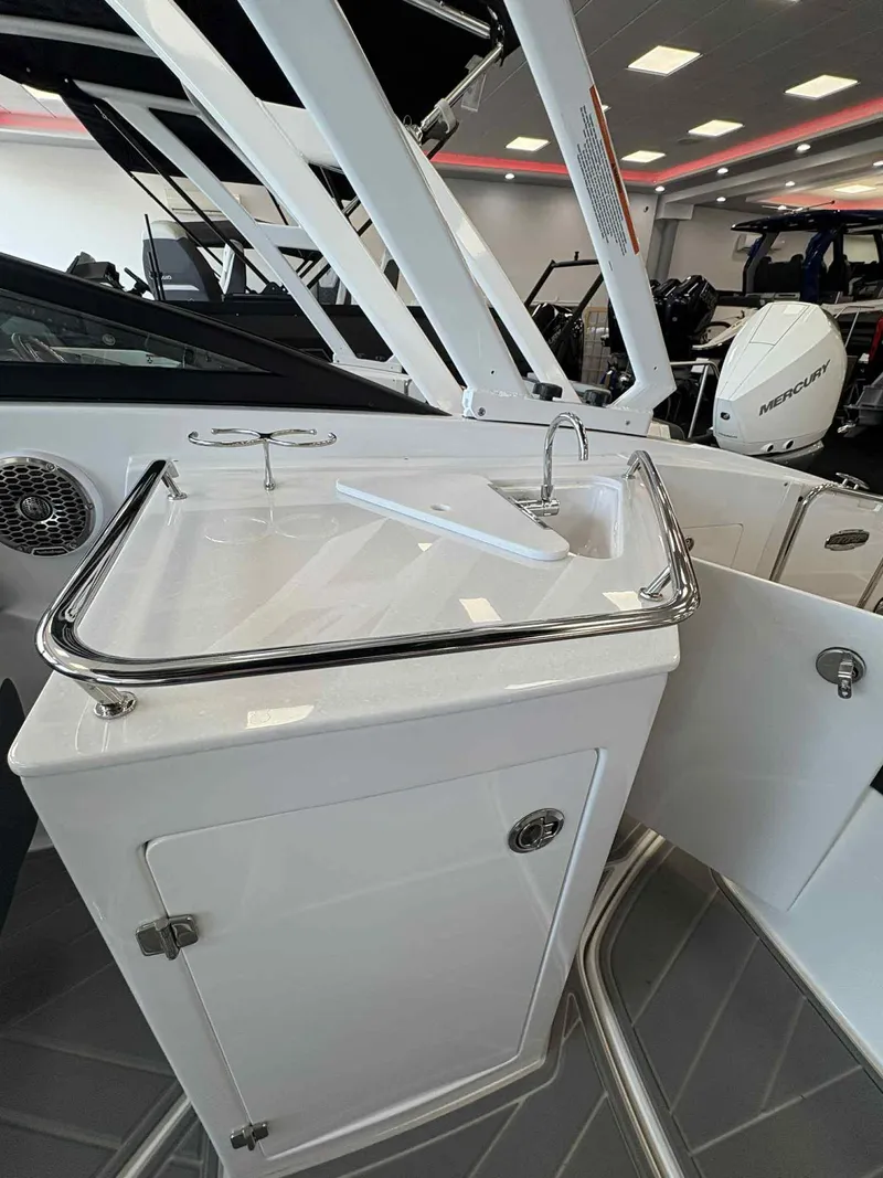 Slide: The Image of 2026 Monterey M65 boat interior with sink and storage cabinet. - 7