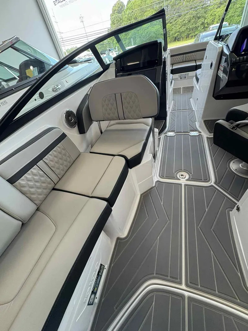 Slide: The Image of 2026 Monterey M65 boat interior with gray and white seating, modern design, and spacious layout. - 9
