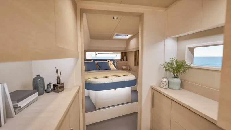 Slide: The Image of Couple relaxing on a 2026 Fountaine Pajot 44 yacht, enjoying the scenic ocean view. - 22