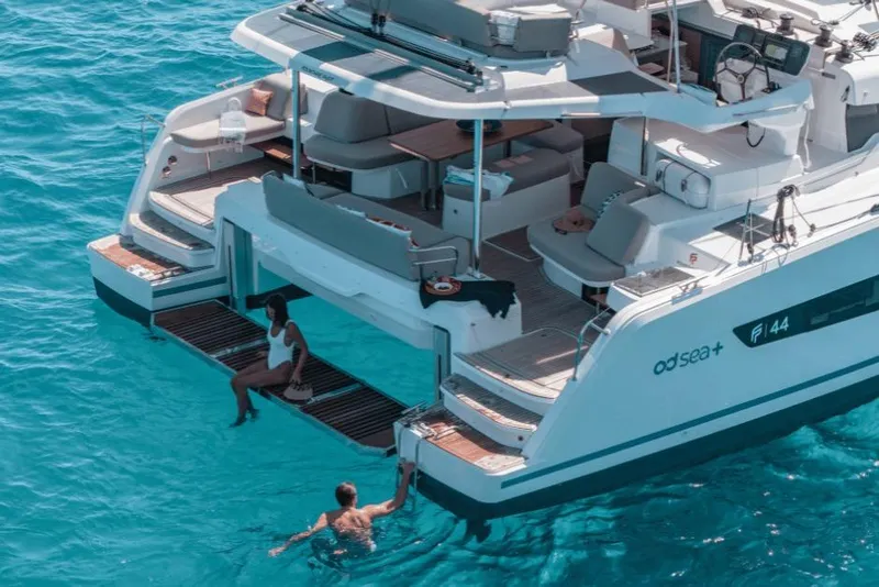 Slide: The Image of Luxury Fountaine Pajot 44 catamaran, 2026 model, with people enjoying the turquoise sea. - 35