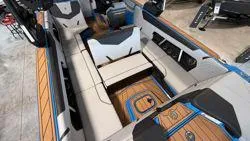 Slide: The Image of 2025 Nautique GS 24 boat interior with modern seating and wood accents. - 3