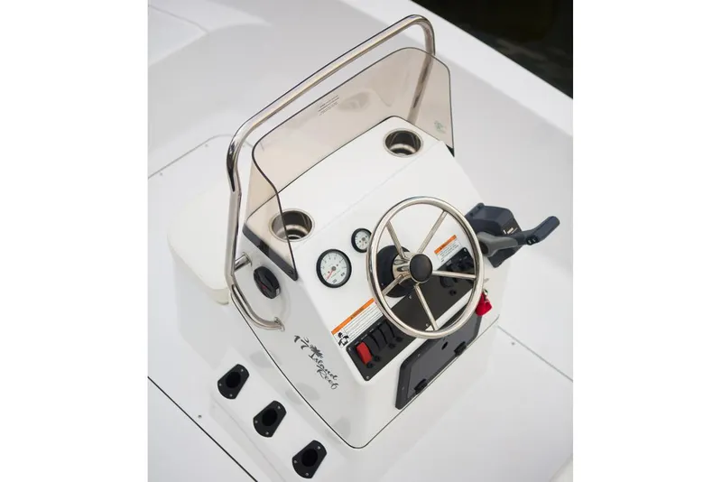 Slide: The Image of Manufacturer Provided Image: 2016 Sportsman Island Reef 17 Center Console boat dashboard with steering wheel and controls. - 14