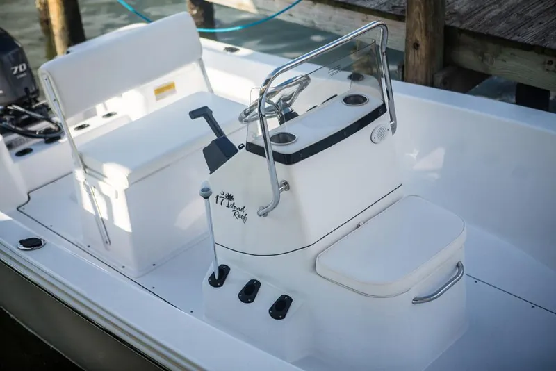 Slide: The Image of Manufacturer Provided Image: 2016 Sportsman Island Reef 17 Center Console boat interior with steering console and seating. - 15