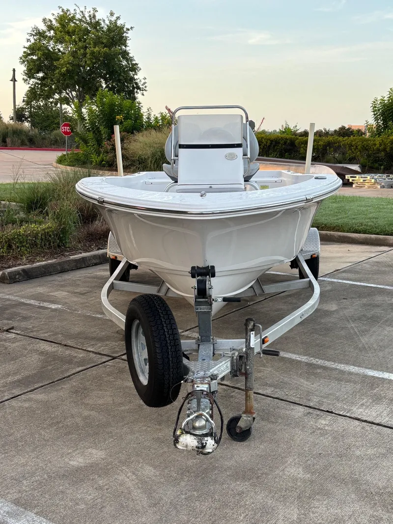 Slide: The Image of 2016 Sportsman Island Reef 17 Center Console boat on trailer in parking lot. - 2