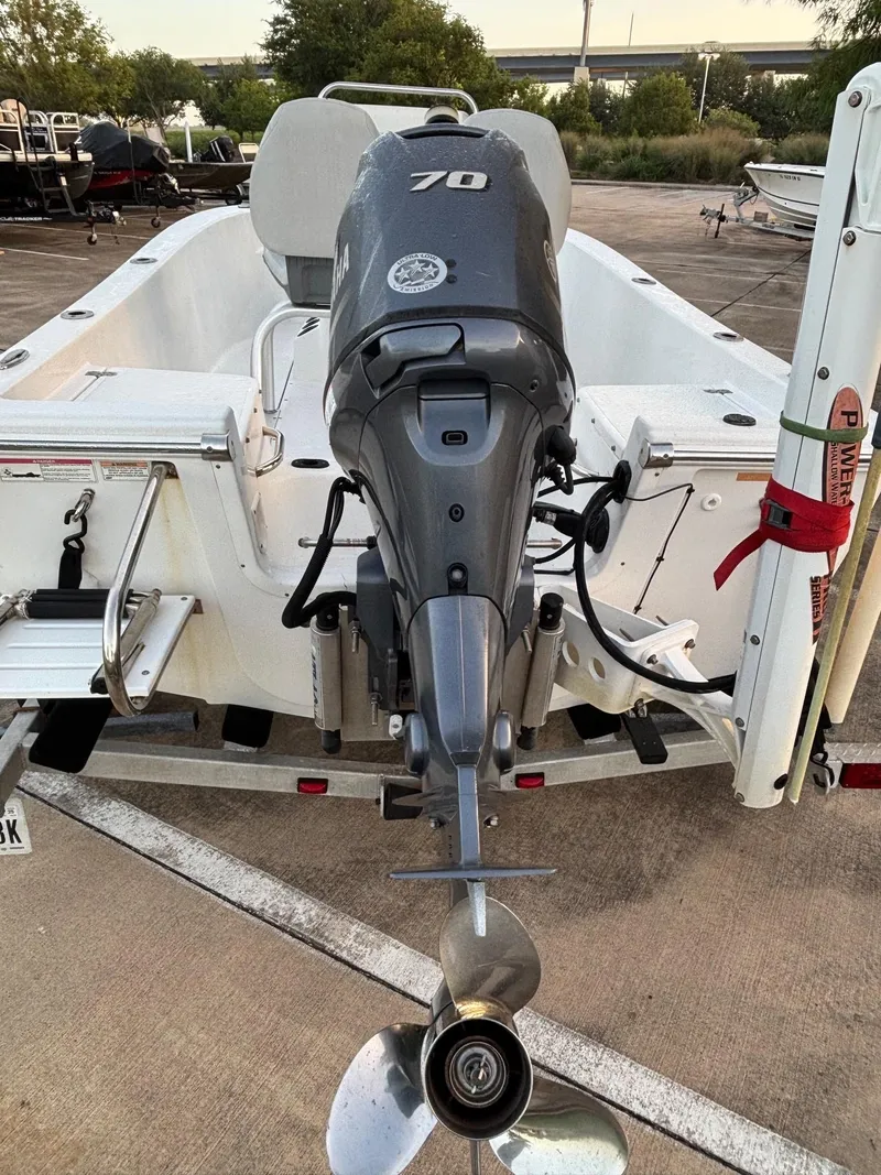 Slide: The Image of 2016 Sportsman Island Reef 17 Center Console boat with 70 HP outboard motor. - 9