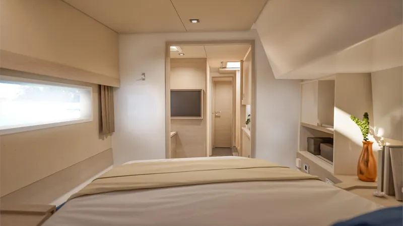 Slide: The Image of Woman in a Fountaine Pajot 44 yacht interior, holding a hat, 2026 model. - 21