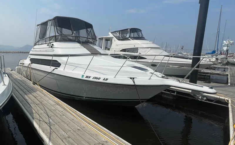 Slide: The Image of 1994 Carver 380 Santego SE yacht docked at marina under clear sky. - 1