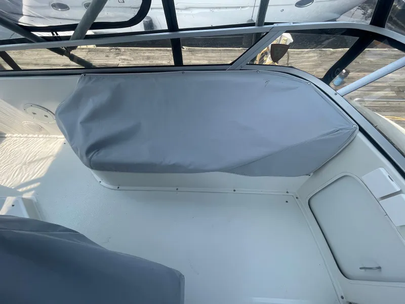 Slide: The Image of 1994 Carver 380 Santego SE boat interior with covered seating area. - 12