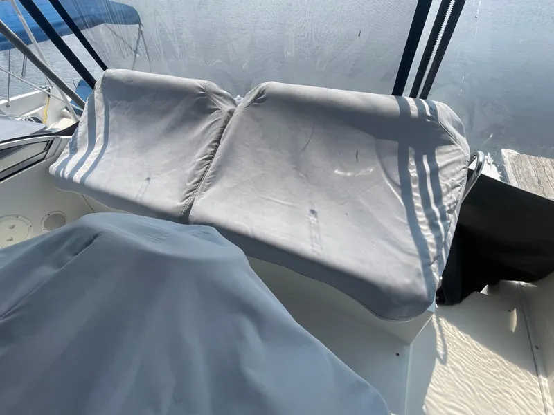 Slide: The Image of 1994 Carver 380 Santego SE boat with covered seating area and protective canopy. - 13