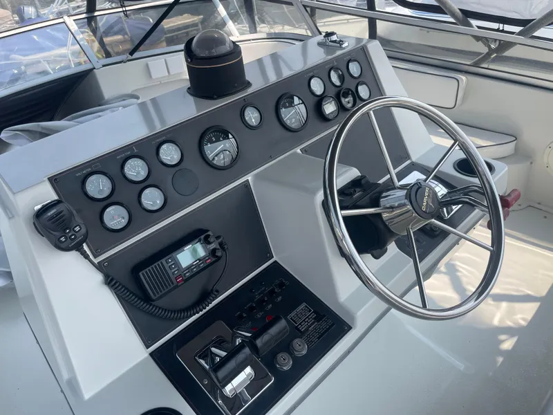 Slide: The Image of 1994 Carver 380 Santego SE helm with steering wheel and control panel. - 23