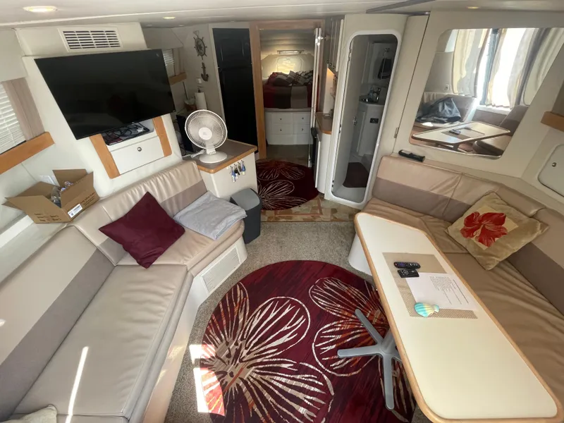 Slide: The Image of Interior of 1994 Carver 380 Santego SE yacht with cozy seating and modern amenities. - 29
