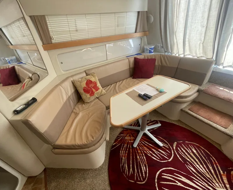 Slide: The Image of Interior of 1994 Carver 380 Santego SE with cozy seating and decorative pillows. - 31