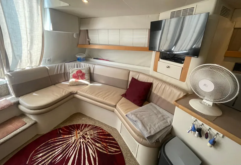 Slide: The Image of Interior of 1994 Carver 380 Santego SE yacht with cozy seating and modern amenities. - 32