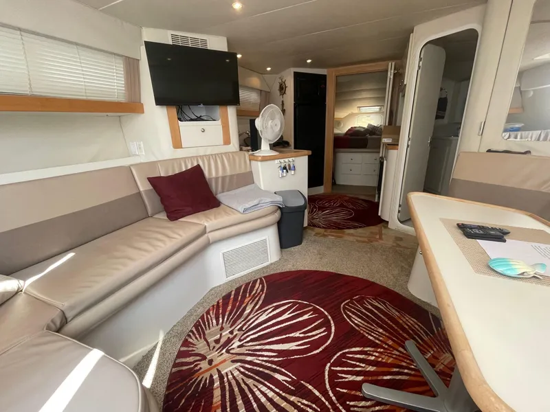 Slide: The Image of Interior of 1994 Carver 380 Santego SE yacht with modern seating and decor. - 33