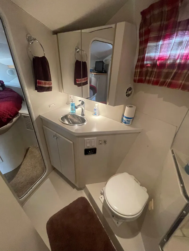 Slide: The Image of 1994 Carver 380 Santego SE bathroom with sink, mirror, and toilet. - 38