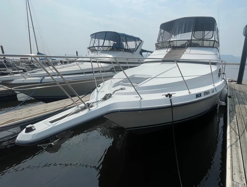 Slide: The Image of 1994 Carver 380 Santego SE yacht docked at marina, side view. - 4