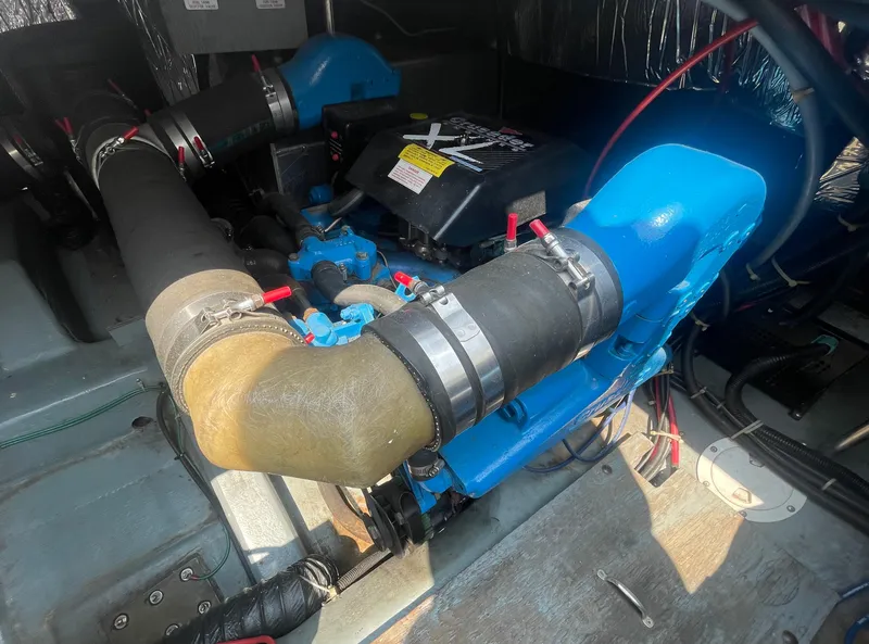Slide: The Image of Engine compartment of a 1994 Carver 380 Santego SE boat, showcasing mechanical components. - 47