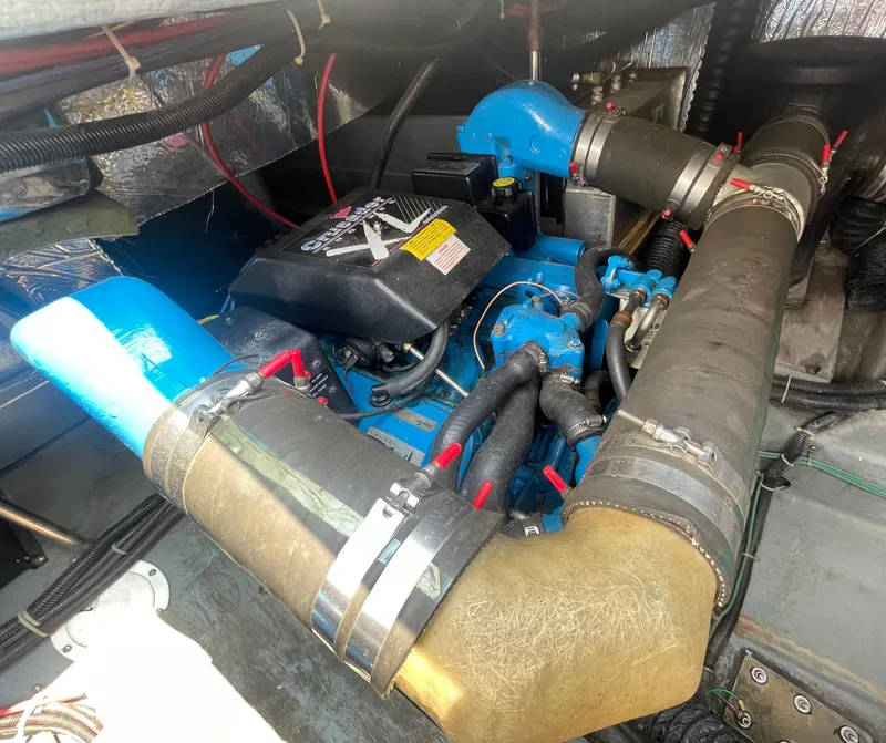 Slide: The Image of Engine compartment of a 1994 Carver 380 Santego SE boat, featuring detailed components. - 48