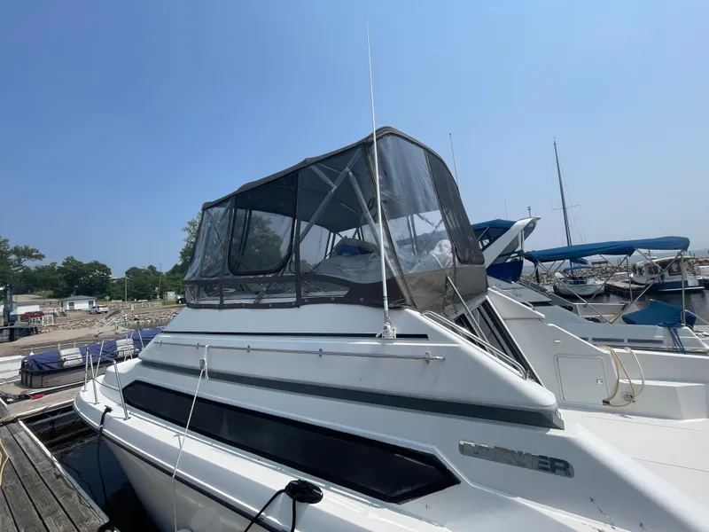 Slide: The Image of 1994 Carver 380 Santego SE yacht docked at marina under clear blue sky. - 9