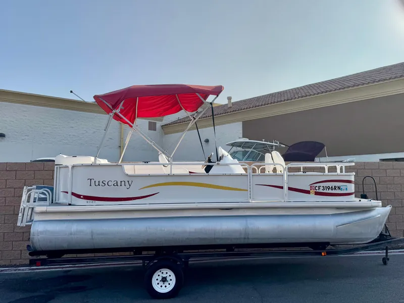 The Image of 2006 Godfrey Tuscany 2080 pontoon boat with red canopy on trailer. - 0