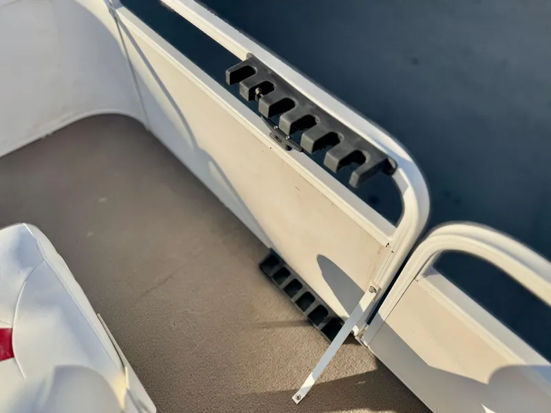 Slide: The Image of Interior of a 2006 Godfrey Tuscany 2080 boat with rod holders. - 11