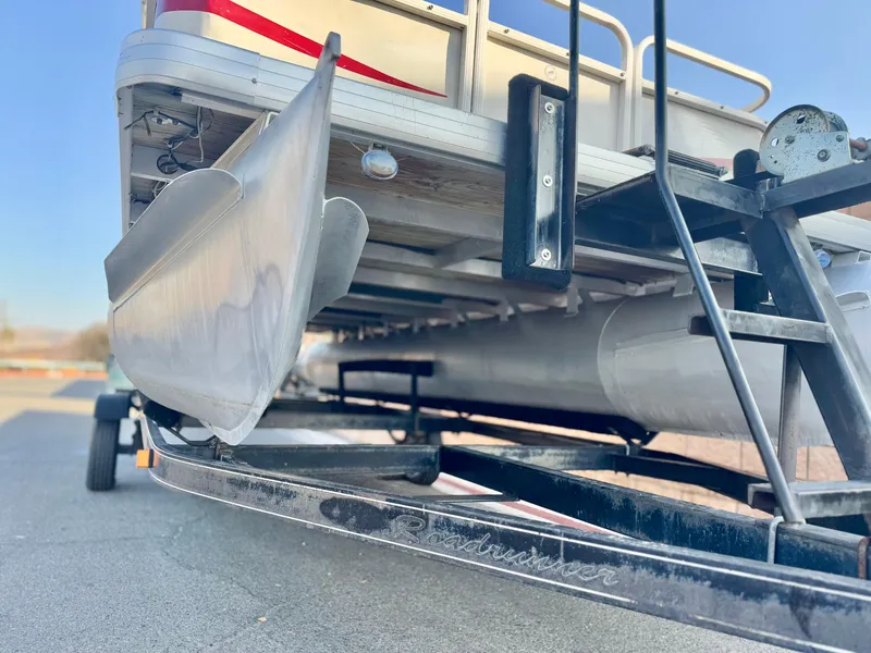 Slide: The Image of 2006 Godfrey Tuscany 2080 pontoon boat on trailer, close-up view of pontoons and frame. - 3