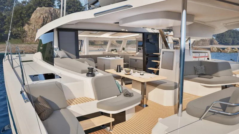 Slide: The Image of People relaxing on a 2026 Fountaine Pajot 44 yacht, enjoying sunny weather and ocean views. - 11