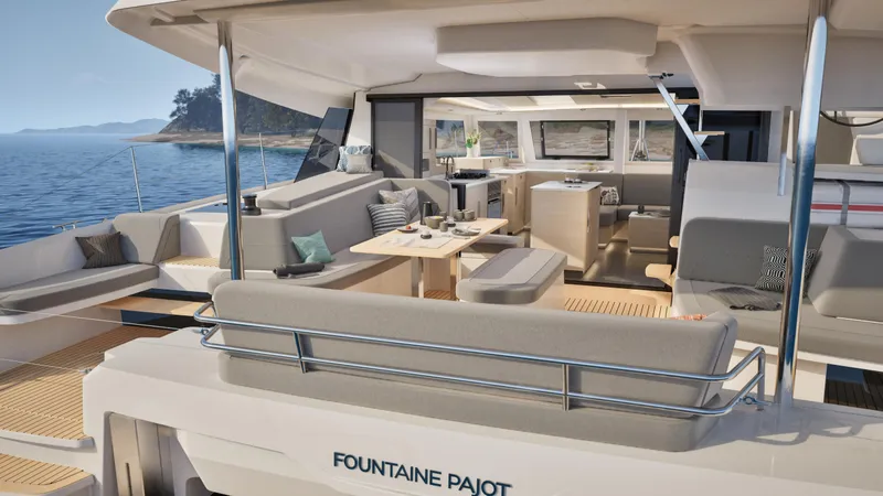 Slide: The Image of 2026 Fountaine Pajot 44 yacht with people enjoying sailing on a sunny day. - 12