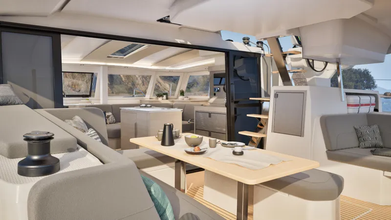 Slide: The Image of People relaxing on a 2026 Fountaine Pajot 44 catamaran sailing on the ocean. - 14