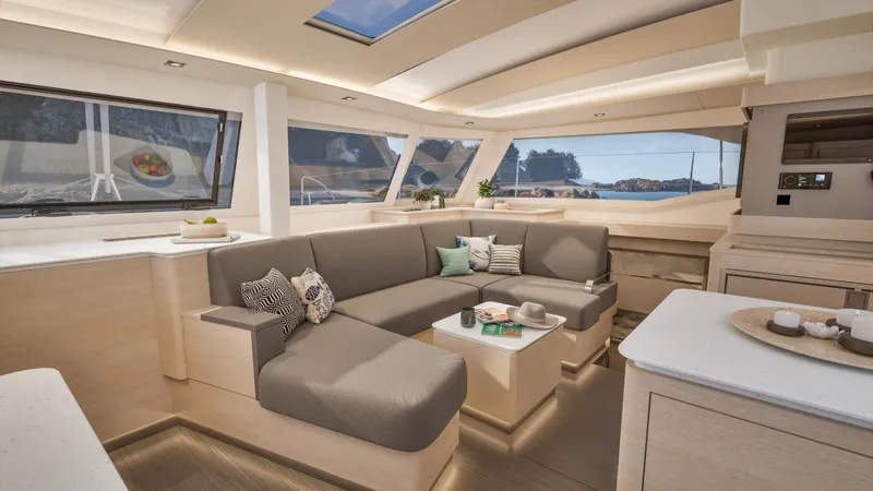 Slide: The Image of Couple enjoying drinks in the luxurious interior of a 2026 Fountaine Pajot 44 yacht. - 21