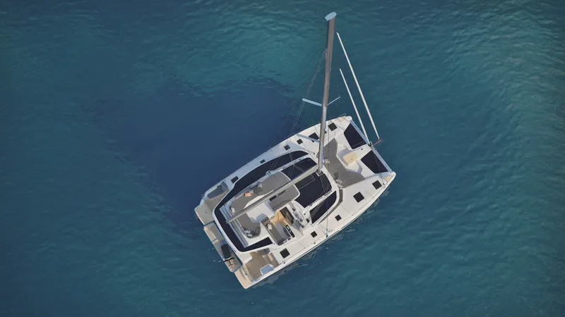 Slide: The Image of 2026 Fountaine Pajot 44 catamaran sailing with passengers, featuring spacious deck and modern design. - 3