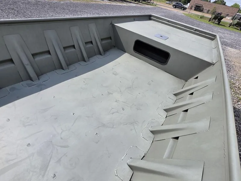 Slide: The Image of 2023 Weldcraft 1544-CDS boat interior, showcasing spacious deck and storage compartment. - 9