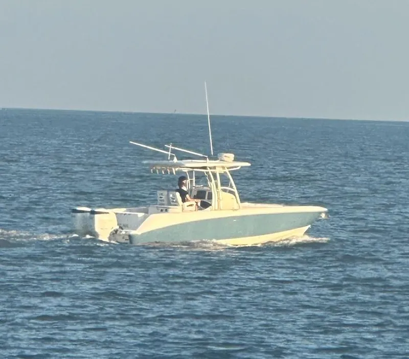The Image of 2004 Boston Whaler 320 Outrage boat cruising on open water. - 0