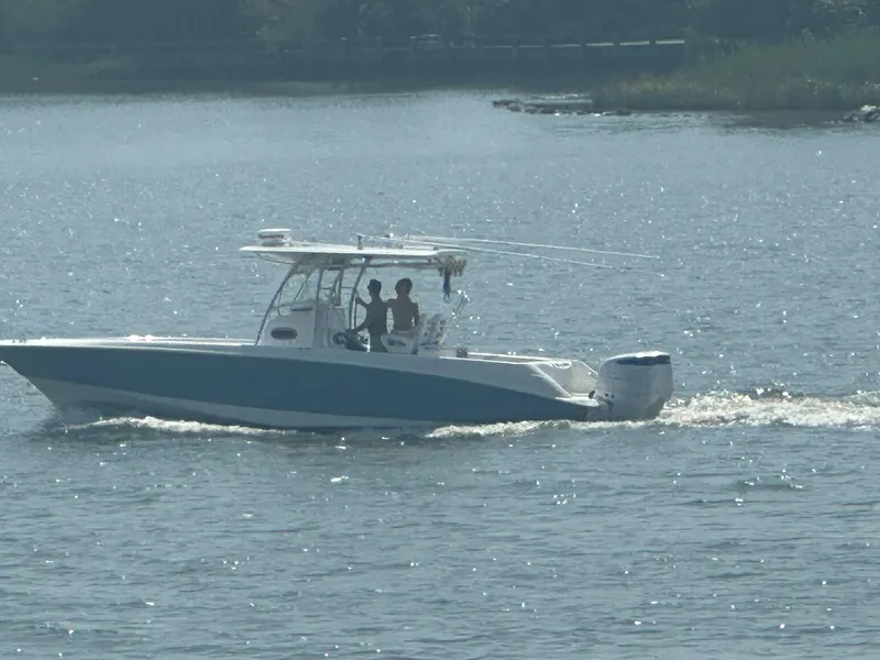 Slide: The Image of 2004 Boston Whaler 320 Outrage cruising on a sunny day. - 12