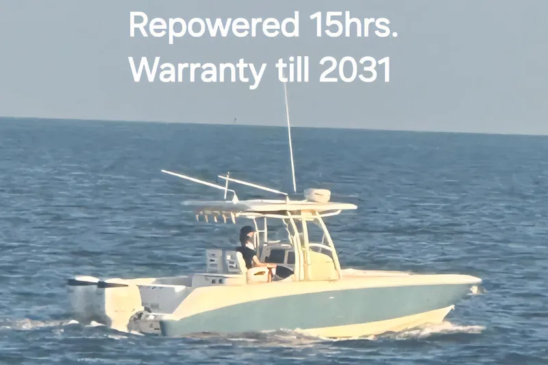 Slide: The Image of 2004 Boston Whaler 320 Outrage boat on water, repowered, warranty until 2031. - 16