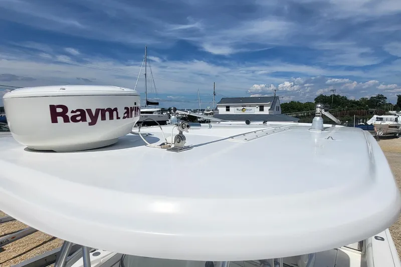 Slide: The Image of Radar equipment on a 2004 Boston Whaler 320 Outrage boat under a clear sky. - 18