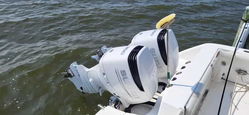 Slide: The Image of Twin Suzuki outboard engines on a 2004 Boston Whaler 320 Outrage boat. - 9