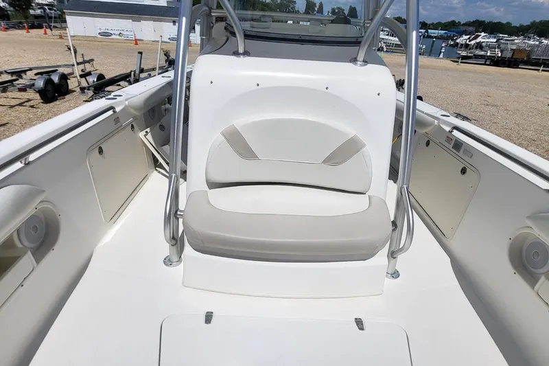 Slide: The Image of 2004 Boston Whaler 320 Outrage boat interior with seating and storage compartments. - 13