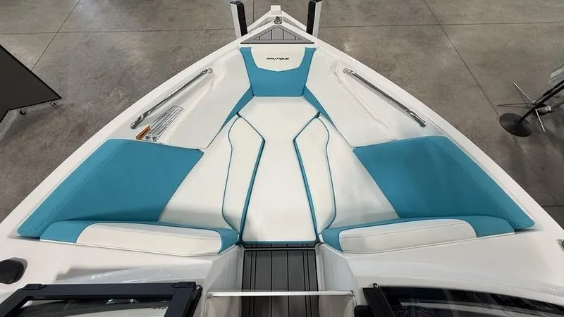 Slide: The Image of 2025 Nautique Ski 200 boat interior with blue and white seating. - 3