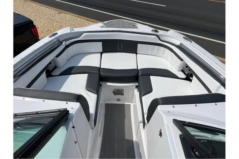 Slide: The Image of 2026 Monterey M-45 boat interior with sleek white and black seating design. - 11