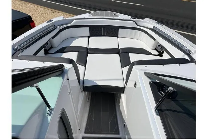 Slide: The Image of 2026 Monterey M-45 boat interior with sleek black and white seating design. - 12