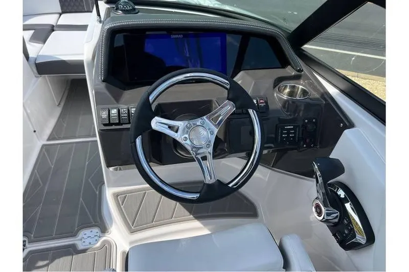 Slide: The Image of 2026 Monterey M-45 boat cockpit with steering wheel and control panel. - 15