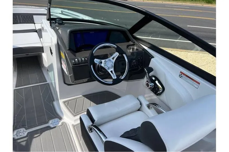 Slide: The Image of 2026 Monterey M-45 boat cockpit with modern steering wheel and sleek dashboard design. - 16