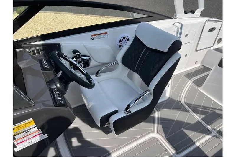 Slide: The Image of 2026 Monterey M-45 boat interior with sleek white and black captain's chair and modern dashboard. - 7