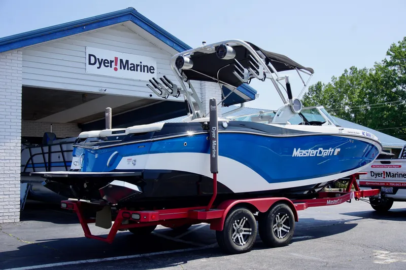 Slide: The Image of 2018 MasterCraft XT22 boat on trailer at Dyer Marine dealership. - 3