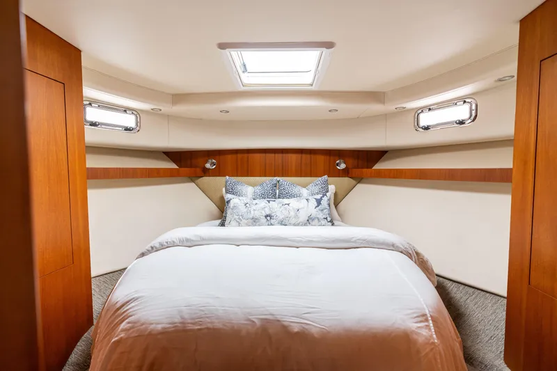 Slide: The Image of Luxurious bedroom interior of 2010 Maritimo M56 yacht with skylight and elegant bedding. - 10