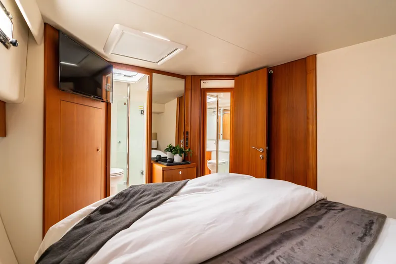 Slide: The Image of Luxurious cabin interior of 2010 Maritimo M56 yacht with wood finishes and modern amenities. - 13